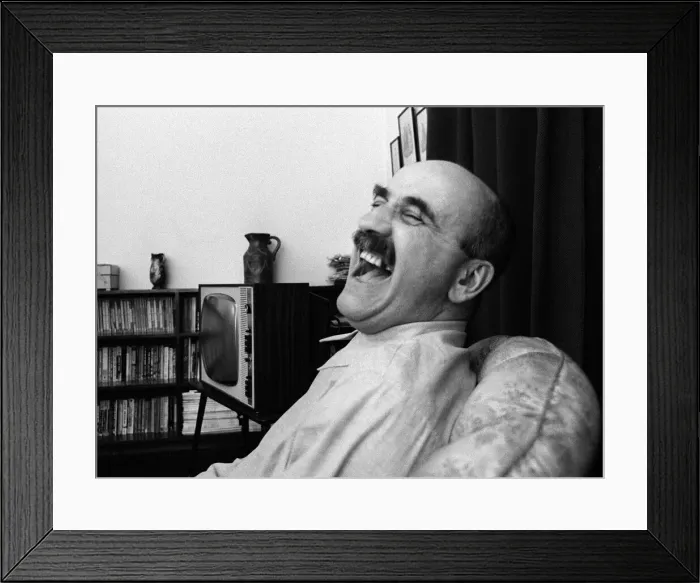 Framed Print : Warren Mitchell has a laugh at home Framed Print : Warren Mitchell has a laugh at home
