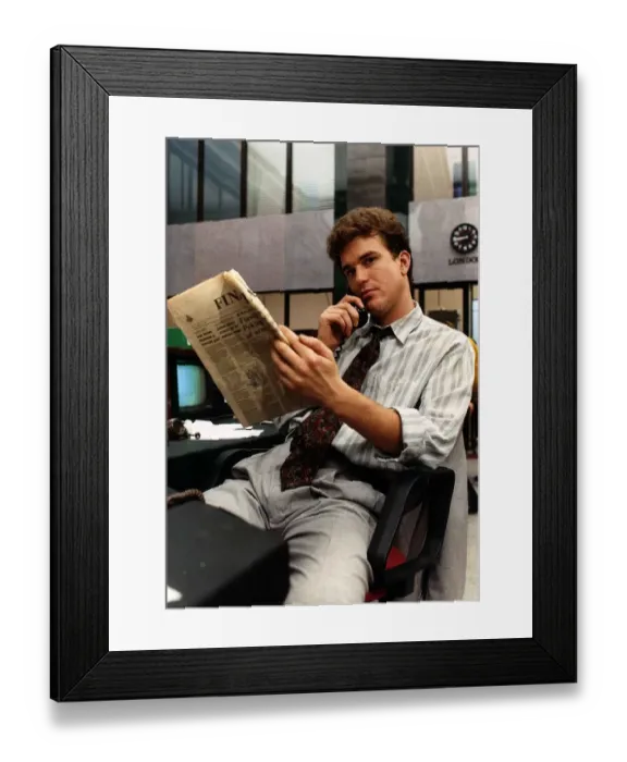 Framed Print : Douglas Hodge actor from TV programme Capitol City, sitting on desk chair talking