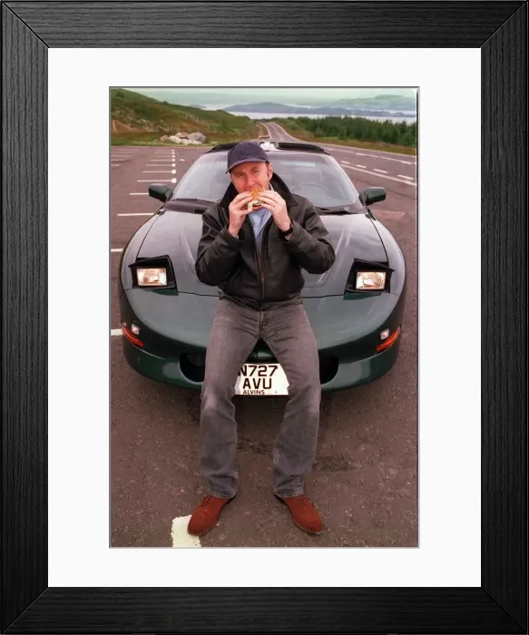 Framed Print : COMEDIAN Fred MacAulay WITH SUPER CAR TRANS AM EATING A HAMBURGER Framed Print : COMEDIAN Fred MacAulay WITH SUPER CAR TRANS AM EATING A HAMBURGER