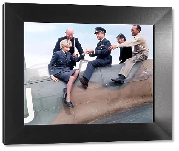 Actor Kenneth More and actress Susannah York seen here sitting on a Spitfire aircraft at