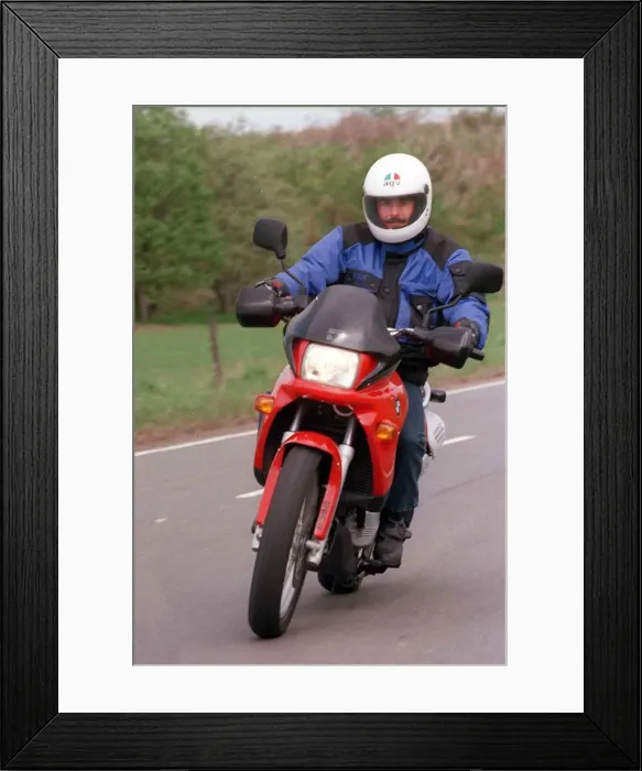 Framed Print : YOUNG TREVOR MARTIN POSING ON THE BMW MOTORBIKE HELMET Framed Print : YOUNG TREVOR MARTIN POSING ON THE BMW MOTORBIKE HELMET