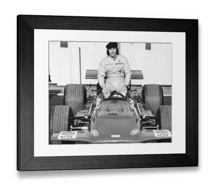 Framed Print : Jackie Stewart world champion racing driver sat on his March 701 F1 car in 1970