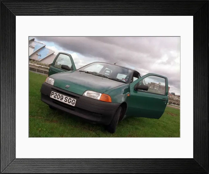 Framed Print : Fiat Punto 55 exterior of car doors open green