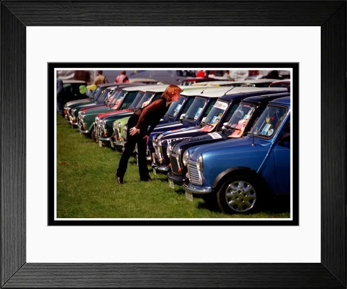 Framed Print : Mini car August 1999 Woman looking at blue Minis Mini cars are at Silverston for 40th Framed Print : Mini car August 1999 Woman looking at blue Minis Mini cars are at Silverston for 40th