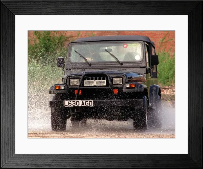 Framed Print : Chrysler Jeep Wrangler driven through puddles with bull bars fitted Framed Print : Chrysler Jeep Wrangler driven through puddles with bull bars fitted