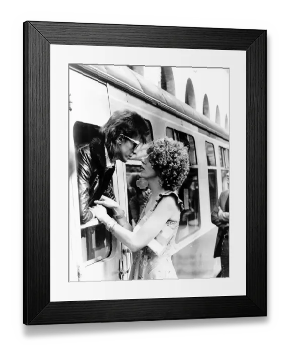 Framed Print : David Bowie leaning out of a railway carriage of the Paris boat train at Victoria station