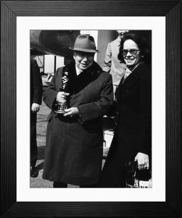 Framed Print : Charlie Chaplin Actor At heathrow airport with his wife Dona - holding his honorary Oscar Framed Print : Charlie Chaplin Actor At heathrow airport with his wife Dona - holding his honorary Oscar