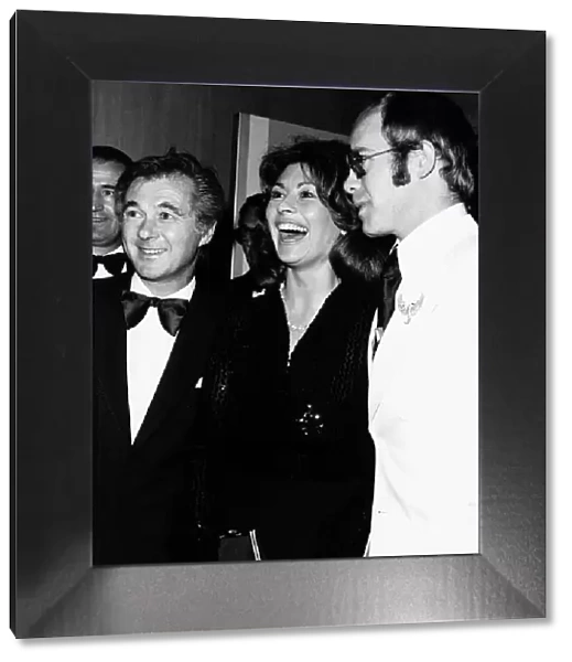 Nanette Newman with husband Bryan Forbes and Elton John at the 'Gold'