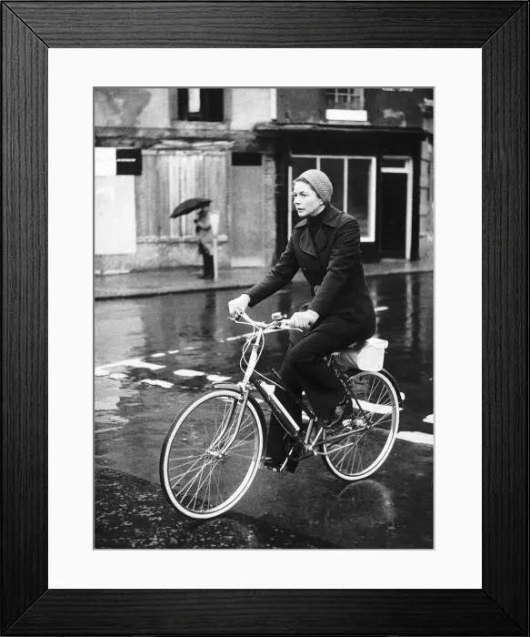 Framed Print : Ingrid Bergman actress riding her bike in the rain dbase MSI brochure Framed Print : Ingrid Bergman actress riding her bike in the rain dbase MSI brochure