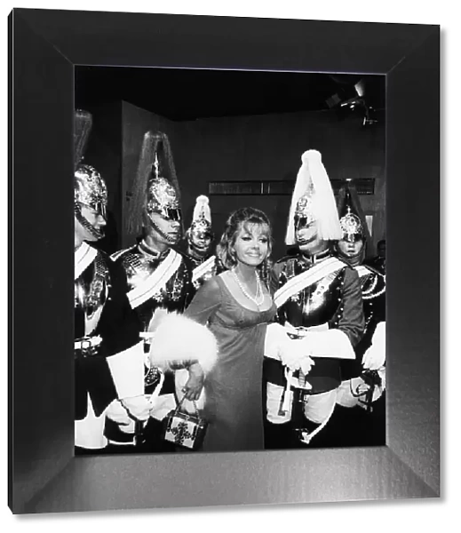 Ingrid Pitt surrounded by a group of Household Cavalry - July 1970 Dbase MSI