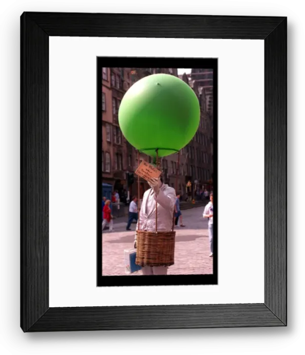 Framed Print : Some of the festival goers in edinburgh August 1998 Man holding green balloon Framed Print : Some of the festival goers in edinburgh August 1998 Man holding green balloon