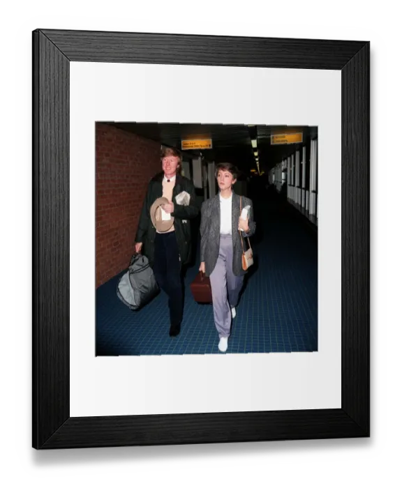 Framed Print : Anne Diamond TV Presenter at London Airport December 1986 with har husband Mike