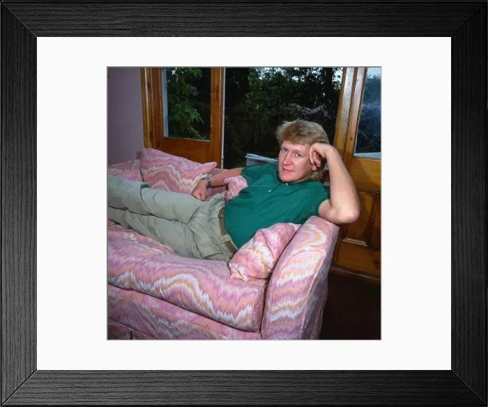 Framed Print : Mike Smith DJ disc jockey TV presenter lying lounging on couch settee sofa
