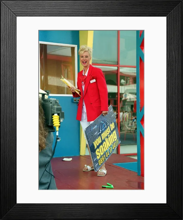 Framed Print : TV Presenter Denise Van Outen of the Big Breakfast Show holding a Framed Print : TV Presenter Denise Van Outen of the Big Breakfast Show holding a