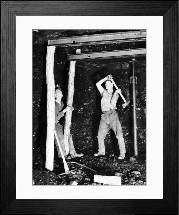 Framed Print : Pitprops being hammered into position under the steel roof supports at Whitehill Colliery Framed Print : Pitprops being hammered into position under the steel roof supports at Whitehill Colliery