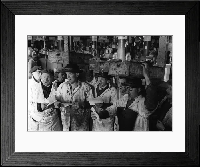 Framed Print : The porters at Billingsgate in London took a break from hauling fish to sing in a