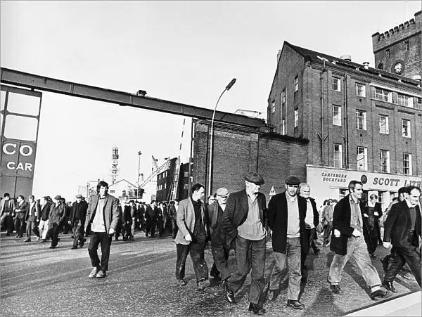 Shipyard workers, engineers and boilermakers leave after the first day at work at Scott
