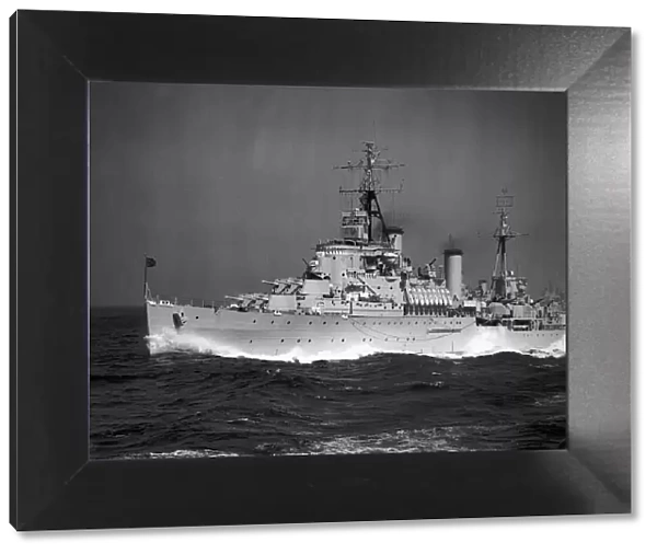 HMS Gambia A Royal Navy Mauritius class cruiser at full speed at sea off of Malta in