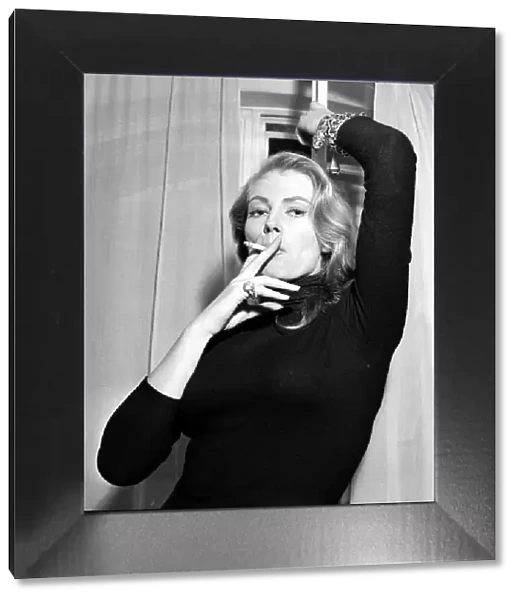 Actress Anita Ekberg seen here during a Daily Mirror photo shoot in her hotel room were