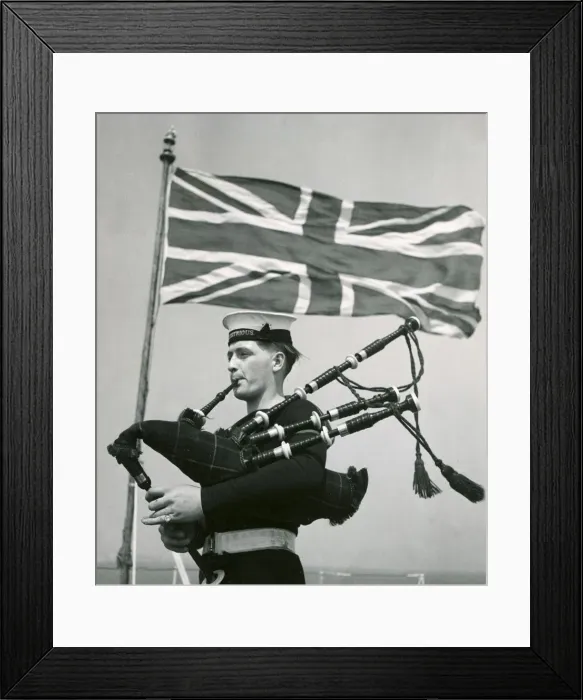 Framed Print : A rating aboard the Royal Navy aircraft carrier HMS Illustrious practising the bagpipes Framed Print : A rating aboard the Royal Navy aircraft carrier HMS Illustrious practising the bagpipes