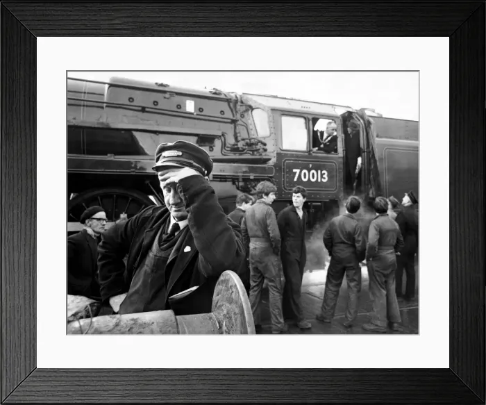 Framed Print : ItOs all too much for driver Charles Carter, as he turns away from watching the departure Framed Print : ItOs all too much for driver Charles Carter, as he turns away from watching the departure