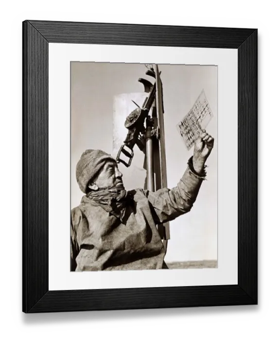 Framed Print : A trawler man on deck, studying an aircraft chart May 1942