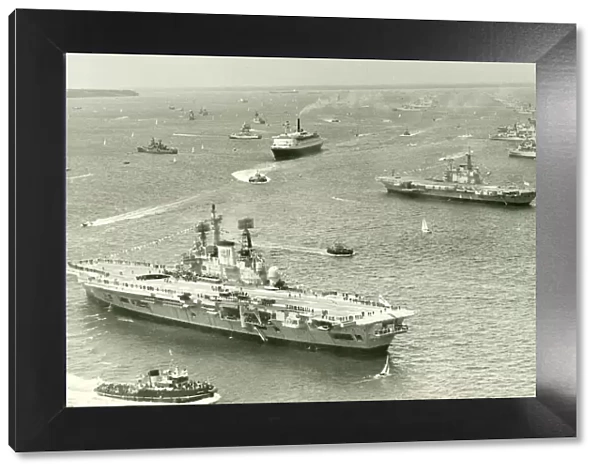 The Cunard liner QEII cruises through the fleet of Royal Navy ships gather at Spithead