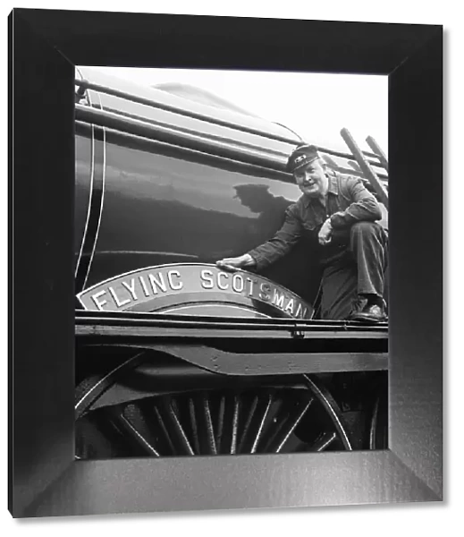 Mr Alan Pegler pictured cleaning The Flying Scotsman Engine name plate