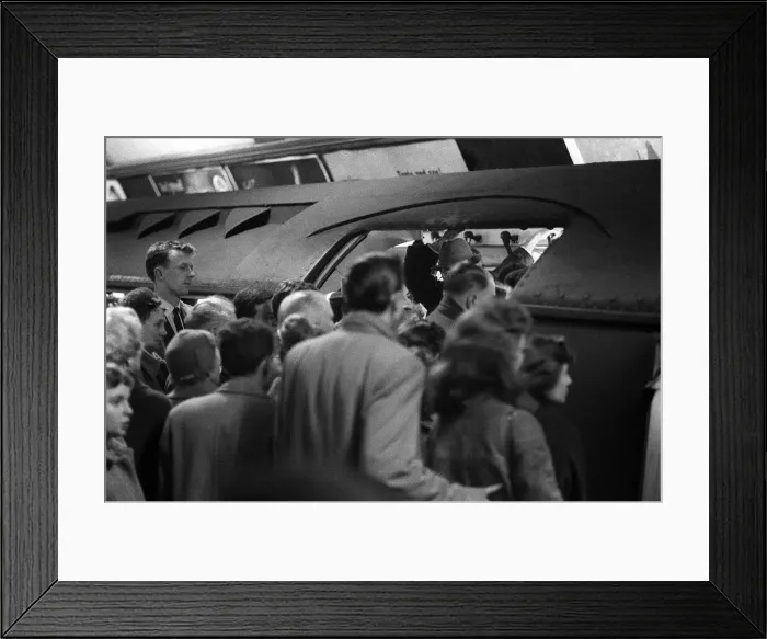 Framed Print : Scenes during the one day rail Strike - February 1960. Commuters try to squeeze Framed Print : Scenes during the one day rail Strike - February 1960. Commuters try to squeeze