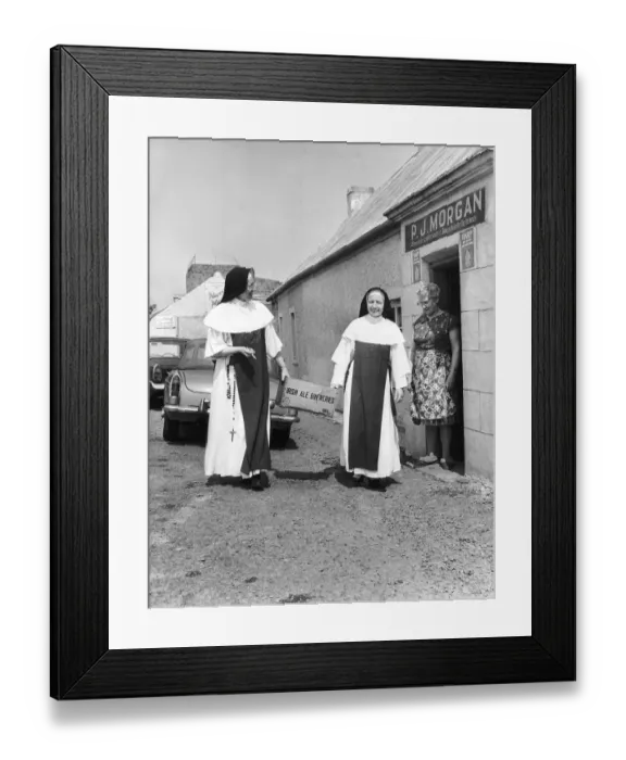 Framed Print : Nuns who are also barmaids in the pub that their mother owns