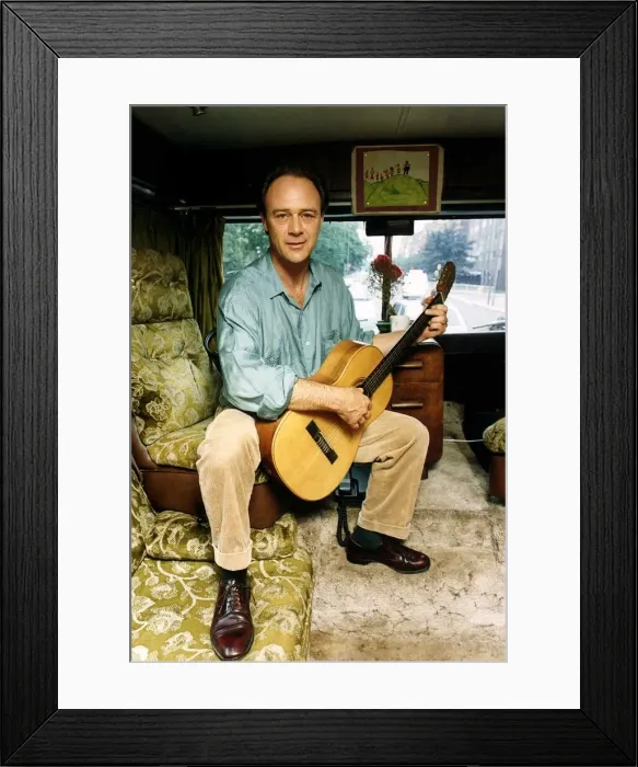 Framed Print : Christopher Cazenove actor sitting in his motor home playing guitar Framed Print : Christopher Cazenove actor sitting in his motor home playing guitar