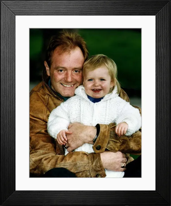 Framed Print : Bruce Jones milkman and actor the star of Raining Stones with his granddaughter Sophie