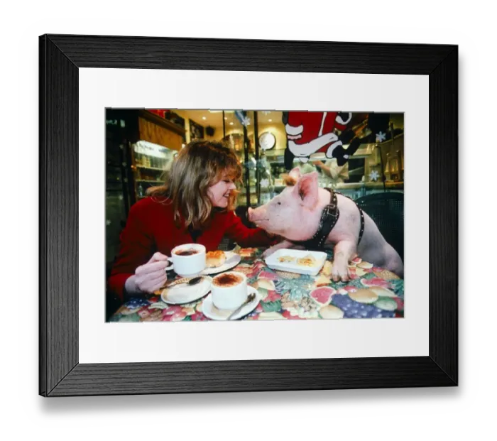 Framed Print : Young Women with Pig at Coffee Table - December 1995 girl at table
