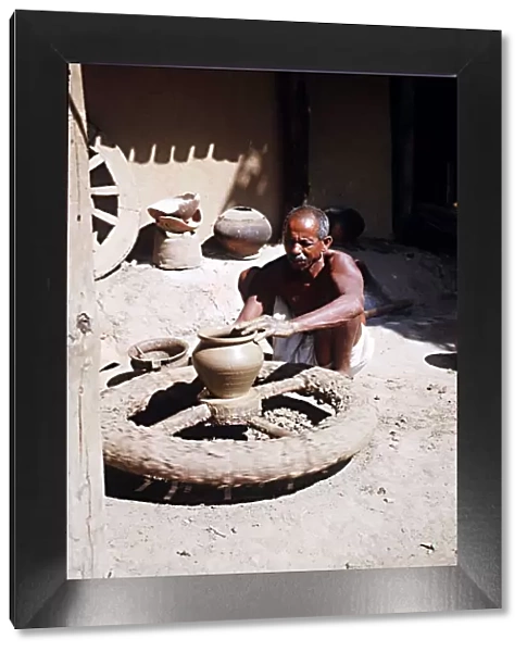 Muria tribal (Gonds) forming clay pot at Narainpur Bastar District MP India