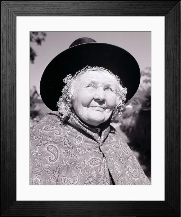 Framed Print : Old lady dressed in traditional clothes Paisley patterned shawl hat tied under chin