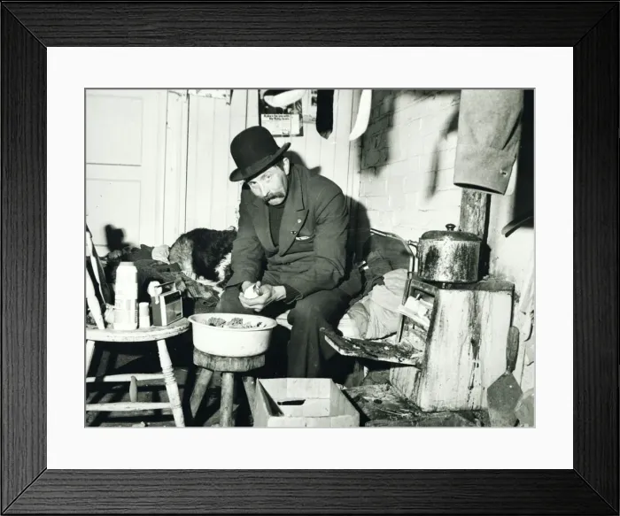 Framed Print : Ned Webb peeling a potato in his small room adjoining a disused stable on a deserted farm Framed Print : Ned Webb peeling a potato in his small room adjoining a disused stable on a deserted farm