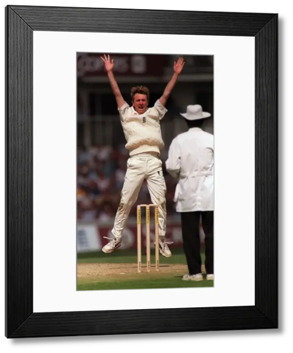 Framed Print : Phil Tufnell of England aug 1999 leaps into the air after taking the wicket of Framed Print : Phil Tufnell of England aug 1999 leaps into the air after taking the wicket of
