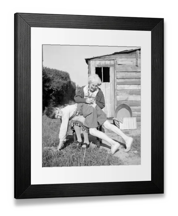 Framed Print : Old lady sewing boys pant needle work Framed Print : Old lady sewing boys pant needle work