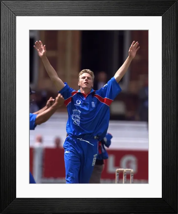 Framed Print : Alan Mullally celebrates taking his third wicket May 1999 for England in their Framed Print : Alan Mullally celebrates taking his third wicket May 1999 for England in their