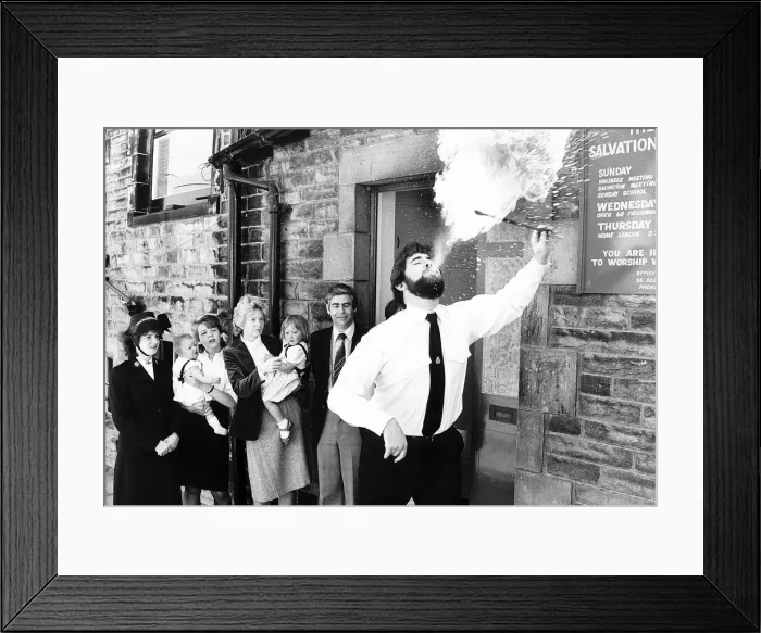 Framed Print : Fire-eater Salvation Army Lt Iain Martin June 1985 demonstrates his talents as a Framed Print : Fire-eater Salvation Army Lt Iain Martin June 1985 demonstrates his talents as a