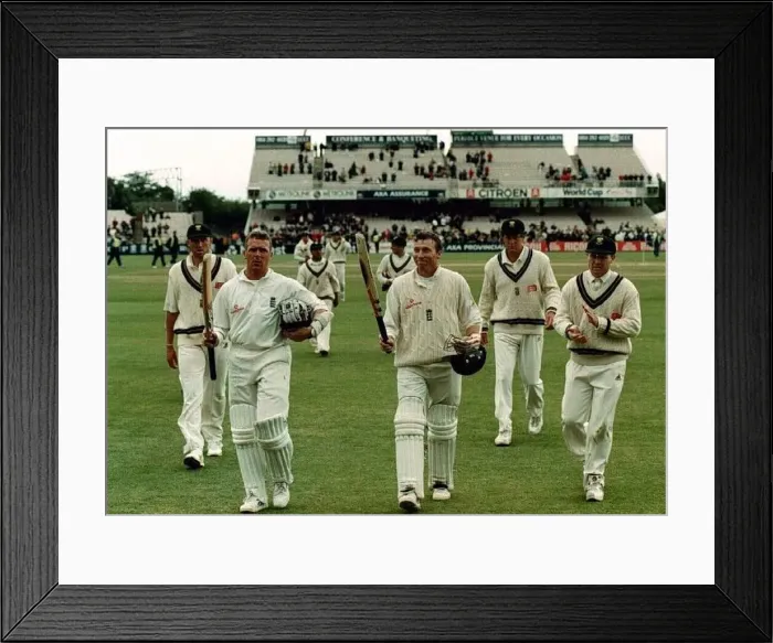  : Mike Atherton and Alec Stewart leave the field July 1998 after putting on over two