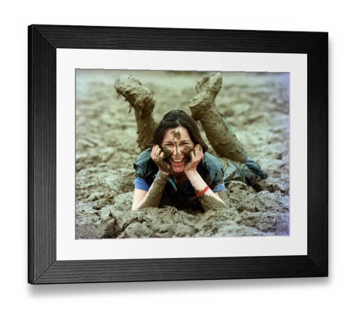 Framed Print : Lucy Rock enjoying the mud at Glastonbury festival June 1997