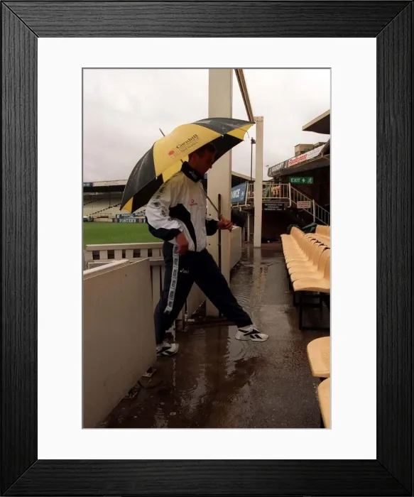 Framed Print : Alec Stewart England Cricket Captain June 1998 walks under an umbrella Framed Print : Alec Stewart England Cricket Captain June 1998 walks under an umbrella