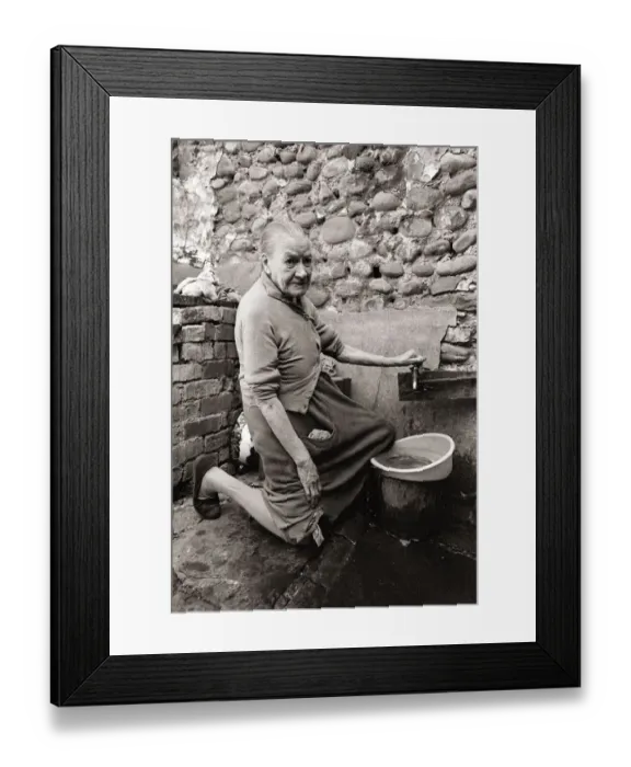 Framed Print : Old Mary Wallace washes her dishes outside in hubert Street in Newtown cardiff Framed Print : Old Mary Wallace washes her dishes outside in hubert Street in Newtown cardiff