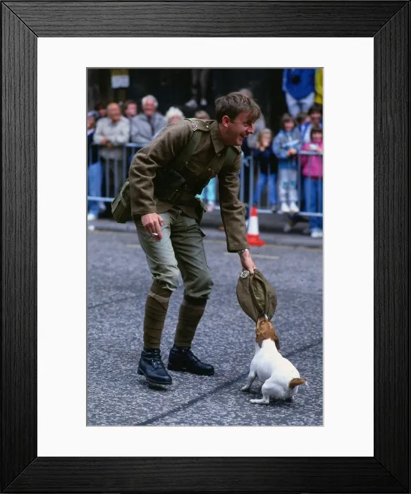 Framed Print : Edinburgh Festival August 1989 Dog chewing soldiers cap holding cigarette Framed Print : Edinburgh Festival August 1989 Dog chewing soldiers cap holding cigarette