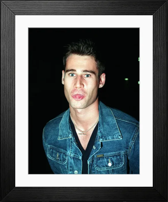 Framed Print : TIM VINCENT TV PRESENTER September 1998 Sticking tongue out at camera denim jacket