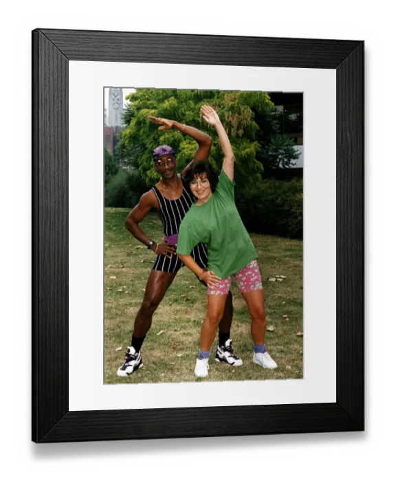 Framed Print : Derrick Evans Mr Motivator with Lorraine Kelly TV presenter doing side stretch in park Framed Print : Derrick Evans Mr Motivator with Lorraine Kelly TV presenter doing side stretch in park
