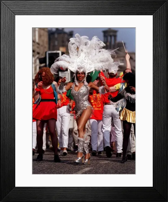 Framed Print : Edinburgh festival aug 1998 edinburgh festival parade a samba dancer dances in