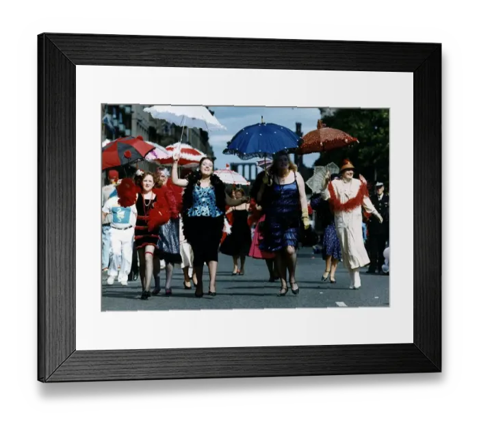 Framed Print : Women dressed as 1920s flapper girls walking down a street during the Edinburgh