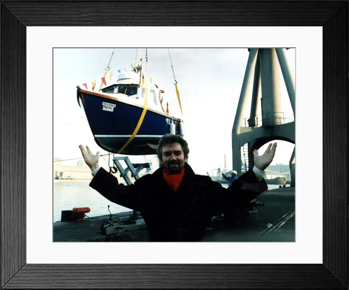 Framed Print : Noel Edmonds TV Presenter at launch of boat Pride of Inverkeith in sling above dock Framed Print : Noel Edmonds TV Presenter at launch of boat Pride of Inverkeith in sling above dock
